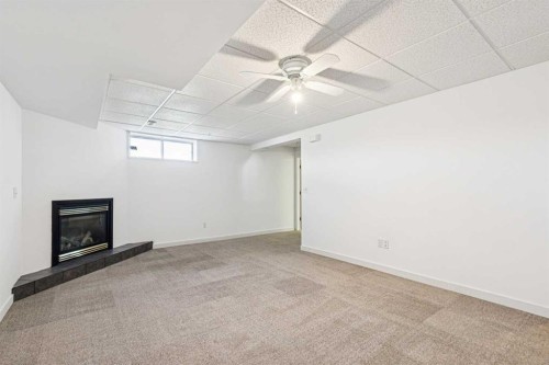 34-105 Elm Place, Okotoks, AB - Indoor With Fireplace