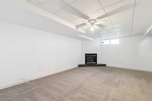 34-105 Elm Place, Okotoks, AB - Indoor With Fireplace