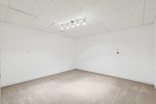 34-105 Elm Place, Okotoks, AB - Indoor Photo Showing Other Room
