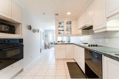 8 Prominence Path Sw, Calgary, AB - Indoor Photo Showing Kitchen With Upgraded Kitchen