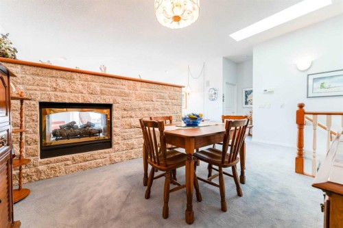 8 Prominence Path Sw, Calgary, AB - Indoor With Fireplace