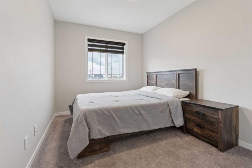 79 Magnolia Heath Se, Calgary, AB - Indoor Photo Showing Bedroom