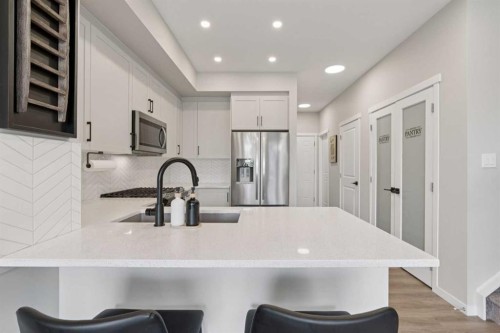 79 Magnolia Heath Se, Calgary, AB - Indoor Photo Showing Kitchen With Upgraded Kitchen