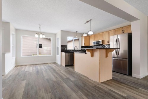 202 Sunset Heights, Cochrane, AB - Indoor Photo Showing Kitchen