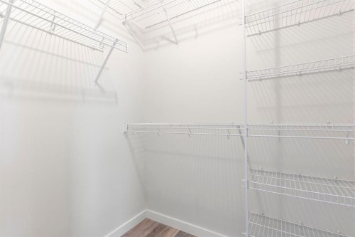 202 Sunset Heights, Cochrane, AB - Indoor With Storage