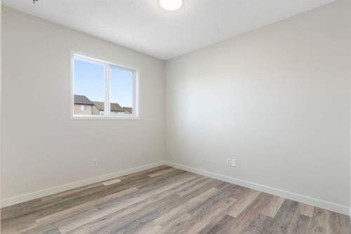 202 Sunset Heights, Cochrane, AB - Indoor Photo Showing Other Room