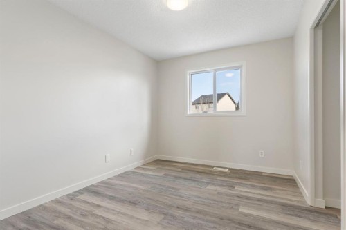 202 Sunset Heights, Cochrane, AB - Indoor Photo Showing Other Room