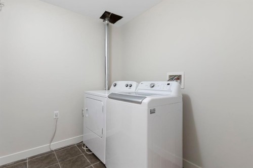 202 Sunset Heights, Cochrane, AB - Indoor Photo Showing Laundry Room