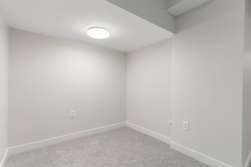 202 Sunset Heights, Cochrane, AB - Indoor Photo Showing Other Room