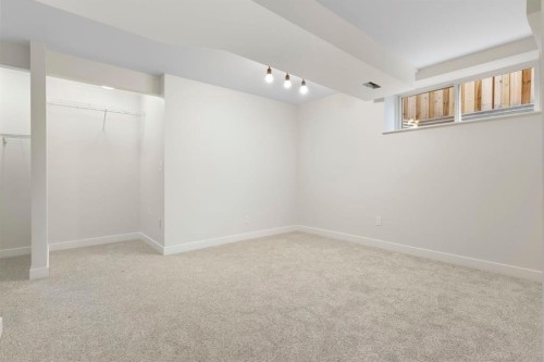 202 Sunset Heights, Cochrane, AB - Indoor Photo Showing Other Room