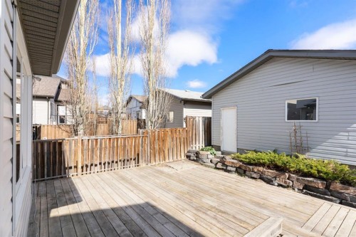 202 Sunset Heights, Cochrane, AB - Outdoor With Deck Patio Veranda With Exterior