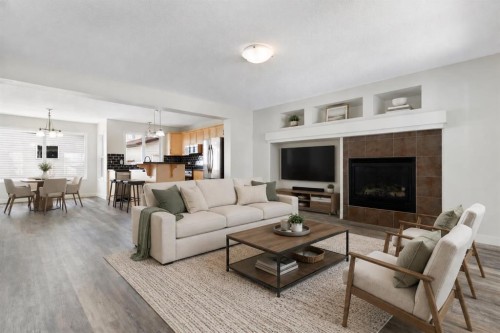 202 Sunset Heights, Cochrane, AB - Indoor Photo Showing Living Room With Fireplace