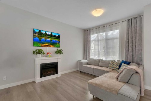 136 Sage Meadows Gardens Nw, Calgary, AB - Indoor Photo Showing Living Room With Fireplace