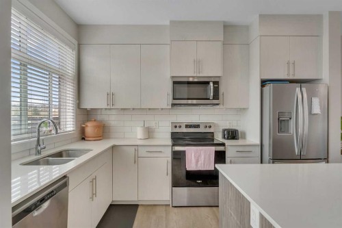 136 Sage Meadows Gardens Nw, Calgary, AB - Indoor Photo Showing Kitchen With Stainless Steel Kitchen With Double Sink With Upgraded Kitchen