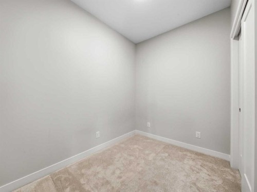 110-660 Shawnee Square Sw, Calgary, AB - Indoor Photo Showing Other Room