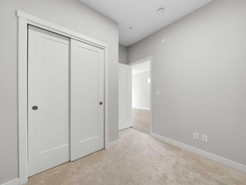 110-660 Shawnee Square Sw, Calgary, AB - Indoor Photo Showing Other Room