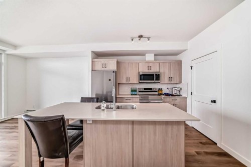 410-30 Sage Hill Walk Nw, Calgary, AB - Indoor Photo Showing Kitchen With Stainless Steel Kitchen With Double Sink