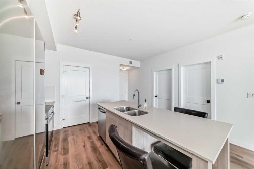 410-30 Sage Hill Walk Nw, Calgary, AB - Indoor Photo Showing Kitchen With Double Sink