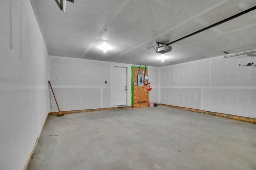 229 South Point Park Sw, Airdrie, AB - Indoor Photo Showing Garage