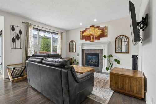 2134 Brightoncrest Common Se, Calgary, AB - Indoor Photo Showing Living Room With Fireplace
