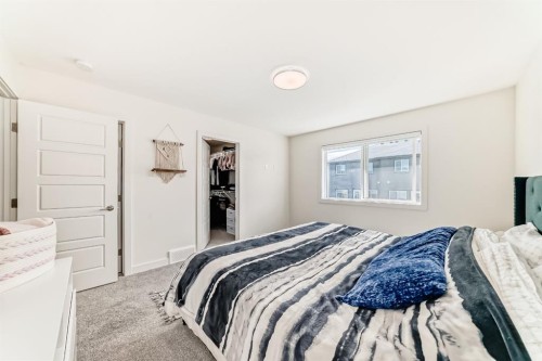 35 Waterford Manor, Chestermere, AB - Indoor Photo Showing Bedroom