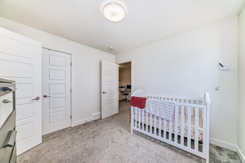 35 Waterford Manor, Chestermere, AB - Indoor Photo Showing Bedroom