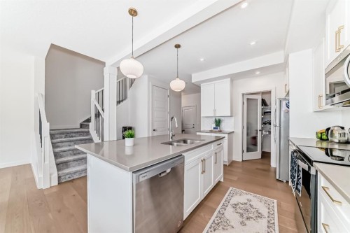 35 Waterford Manor, Chestermere, AB - Indoor Photo Showing Kitchen With Double Sink With Upgraded Kitchen