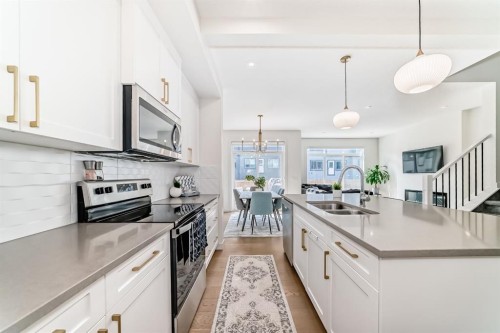 35 Waterford Manor, Chestermere, AB - Indoor Photo Showing Kitchen With Double Sink With Upgraded Kitchen