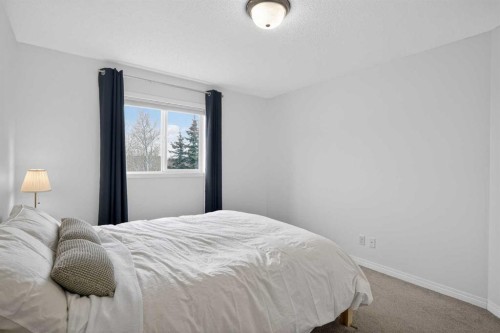 8050 Cougar Ridge Avenue Sw, Calgary, AB - Indoor Photo Showing Bedroom