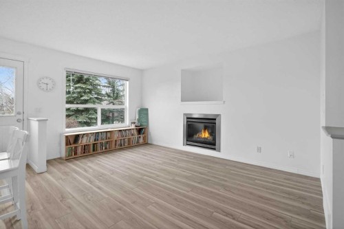 8050 Cougar Ridge Avenue Sw, Calgary, AB - Indoor Photo Showing Living Room With Fireplace