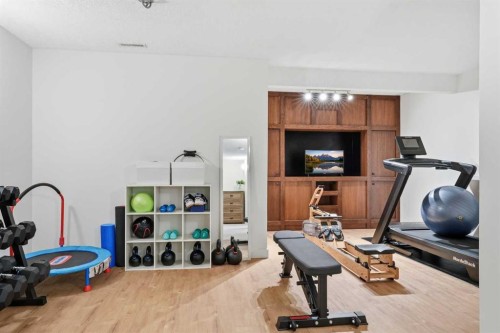 15 Valley Stream Manor Nw, Calgary, AB - Indoor Photo Showing Gym Room