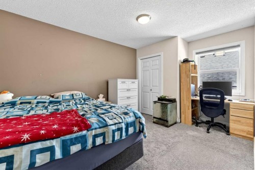 99 Evansmeade Crescent Nw, Calgary, AB - Indoor Photo Showing Bedroom