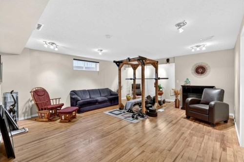 99 Evansmeade Crescent Nw, Calgary, AB - Indoor Photo Showing Gym Room