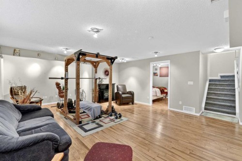 99 Evansmeade Crescent Nw, Calgary, AB - Indoor Photo Showing Gym Room