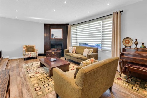549 Rundleville Place Ne, Calgary, AB - Indoor Photo Showing Living Room With Fireplace