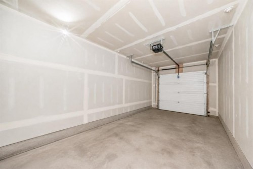 202-245 Redstone Walk Ne, Calgary, AB - Indoor Photo Showing Garage
