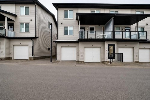202-245 Redstone Walk Ne, Calgary, AB - Outdoor With Balcony With Facade