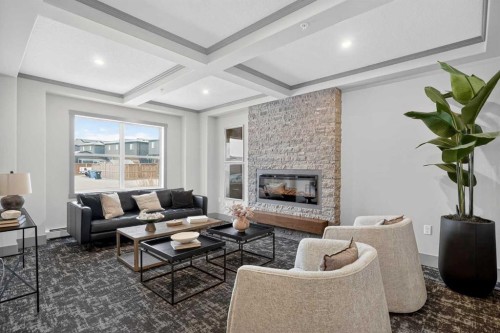 301-55 Wolf Hollow Crescent Se, Calgary, AB - Indoor Photo Showing Living Room With Fireplace
