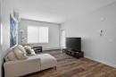 301-55 Wolf Hollow Crescent Se, Calgary, AB  - Indoor Photo Showing Living Room 