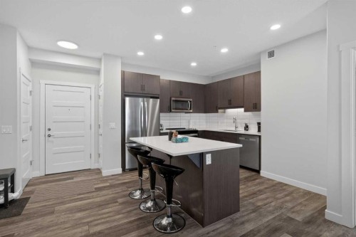 301-55 Wolf Hollow Crescent Se, Calgary, AB - Indoor Photo Showing Kitchen With Stainless Steel Kitchen With Upgraded Kitchen