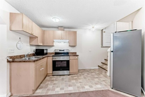 38 San Diego Way Ne, Calgary, AB - Indoor Photo Showing Kitchen With Double Sink