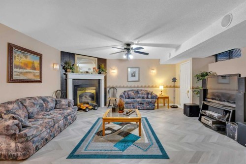 189 Applemead Close Se, Calgary, AB - Indoor Photo Showing Living Room With Fireplace