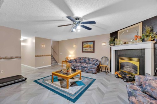 189 Applemead Close Se, Calgary, AB - Indoor Photo Showing Living Room With Fireplace