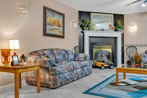 189 Applemead Close Se, Calgary, AB - Indoor Photo Showing Living Room With Fireplace