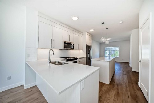 7403 202 Avenue Se, Calgary, AB - Indoor Photo Showing Kitchen With Double Sink With Upgraded Kitchen