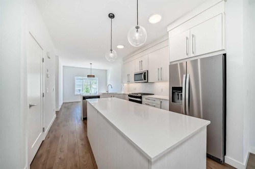 7403 202 Avenue Se, Calgary, AB - Indoor Photo Showing Kitchen With Stainless Steel Kitchen With Upgraded Kitchen