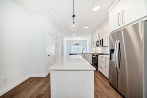 7403 202 Avenue Se, Calgary, AB - Indoor Photo Showing Kitchen With Stainless Steel Kitchen With Upgraded Kitchen