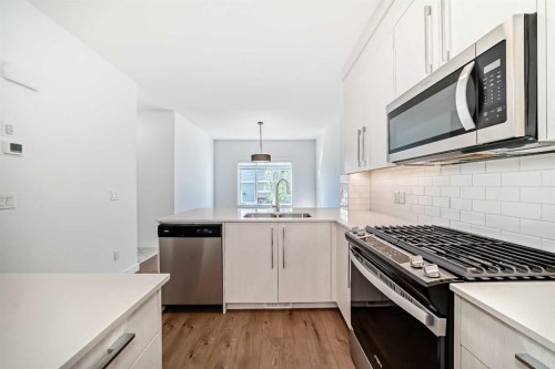 7403 202 Avenue Se, Calgary, AB - Indoor Photo Showing Kitchen With Stainless Steel Kitchen With Double Sink With Upgraded Kitchen