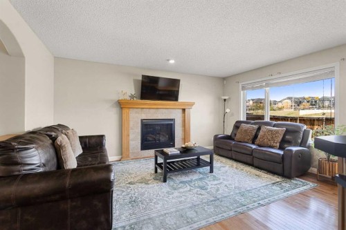 92 Covehaven Terrace Ne, Calgary, AB - Indoor Photo Showing Living Room With Fireplace