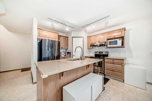 83 Hawkmount Green Nw, Calgary, AB - Indoor Photo Showing Kitchen With Double Sink
